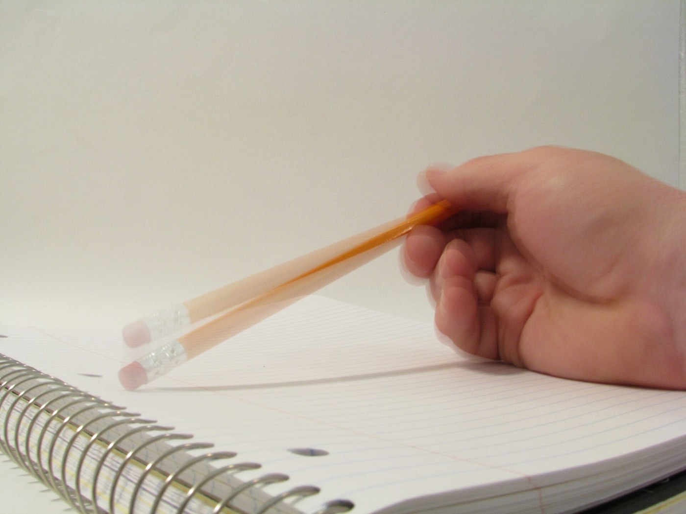 Notebook and pencil for organizing notes; illustrative image
